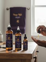 Man applying Unique Style 2 Envy Inc Healing Growth Beard Oil from a dropper onto his palm in a bathroom setting.