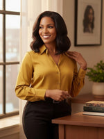 Unique Style 2 Envy Inc short bob lace front human hair wig on a woman in a mustard blouse in a bright office setting.