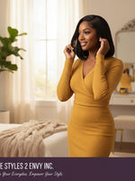 Woman wearing a Unique Style 2 Envy Inc short black bob lace front human hair wig in a bright, modern bedroom.